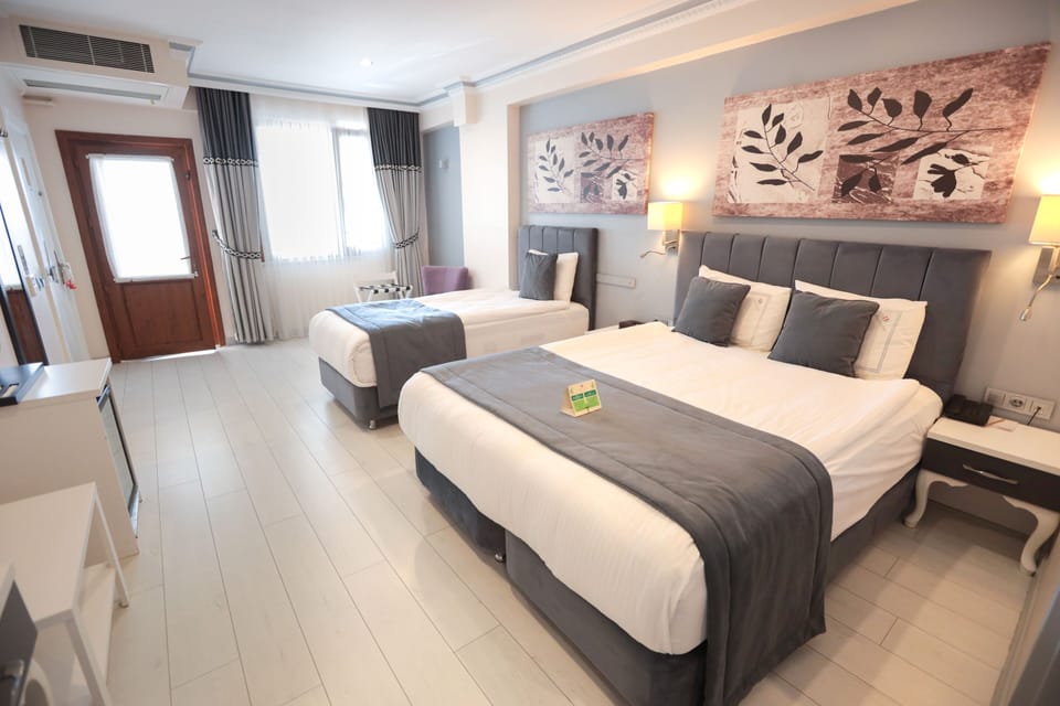Family Suite | Premium bedding, minibar, in-room safe, individually decorated