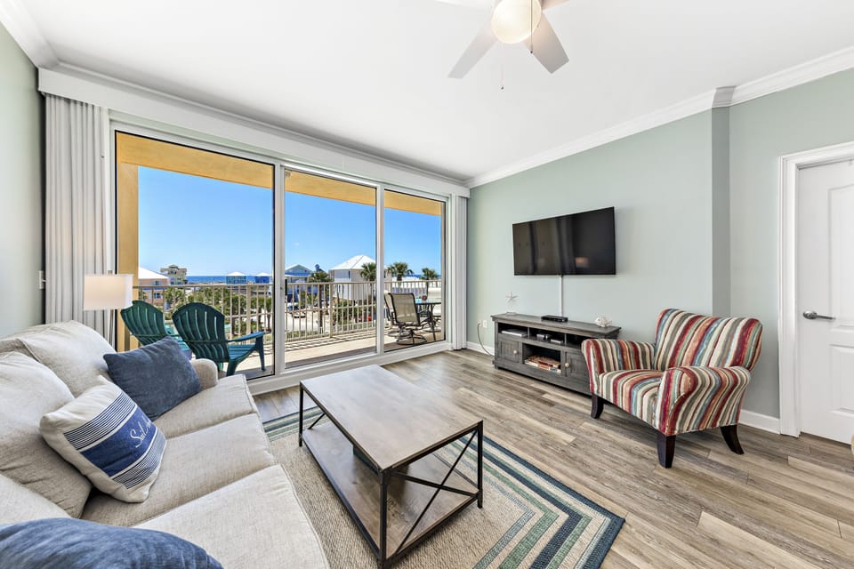 Living room. Step out to balcony overlooking pool and ocean.
