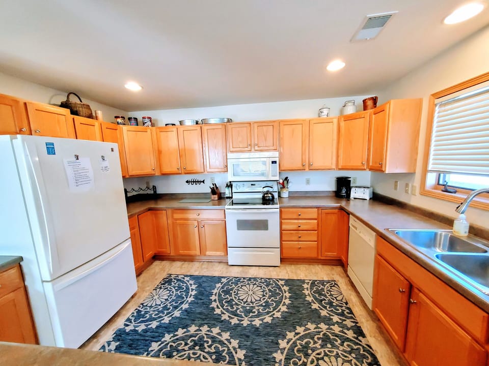 Discover a fully stocked kitchen, a haven for culinary enthusiasts