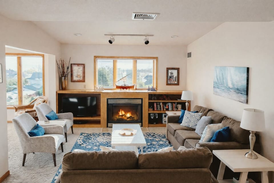Cozy up in our inviting living room with a gas fireplace and TV