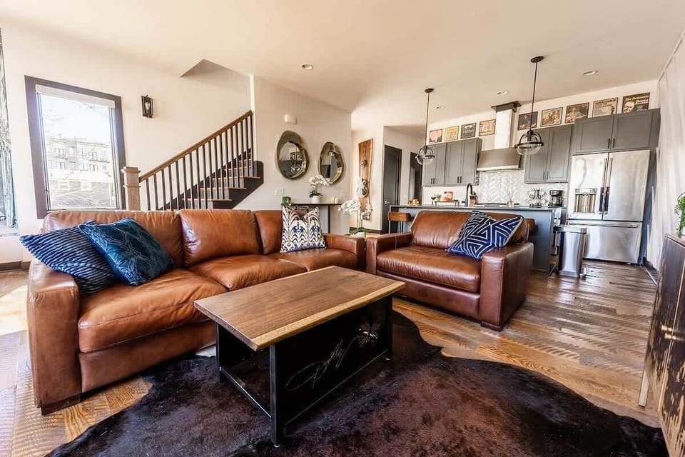 Extremely detailed designer living area with luxury furnishings, flat screen TV, and Piano bar.