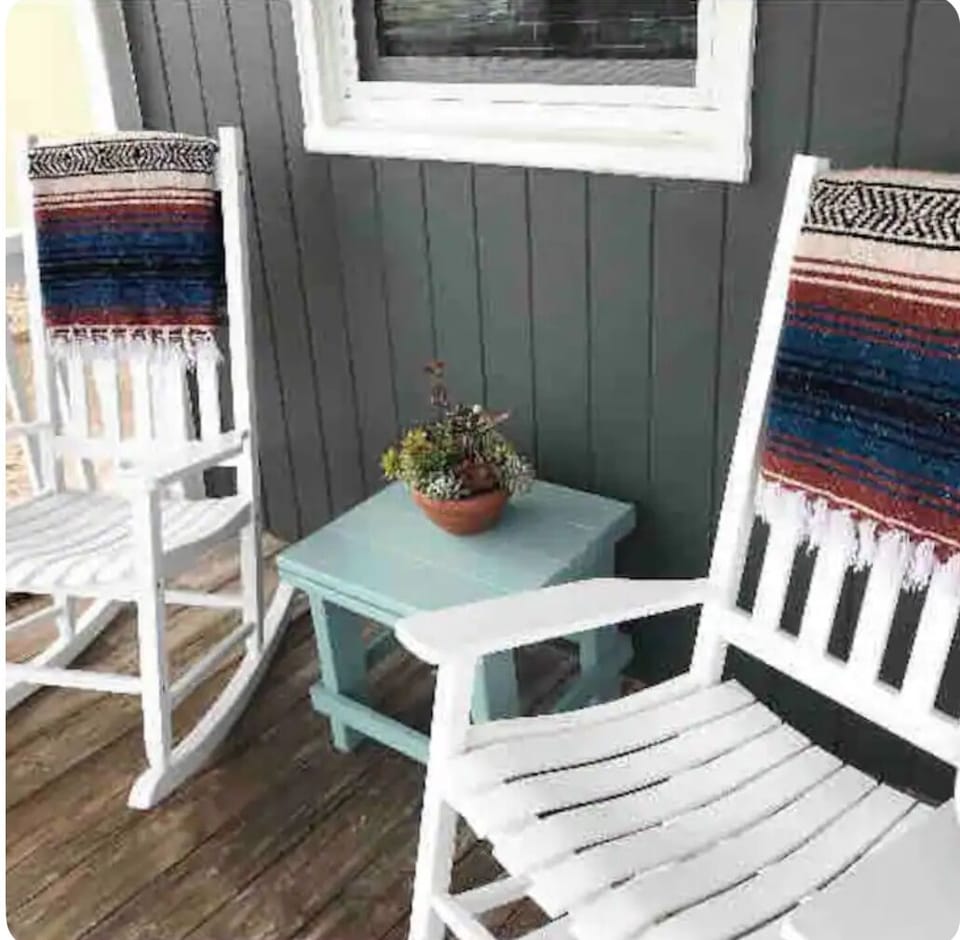 Front porch that faces the ocean/sand that is only steps from the home.