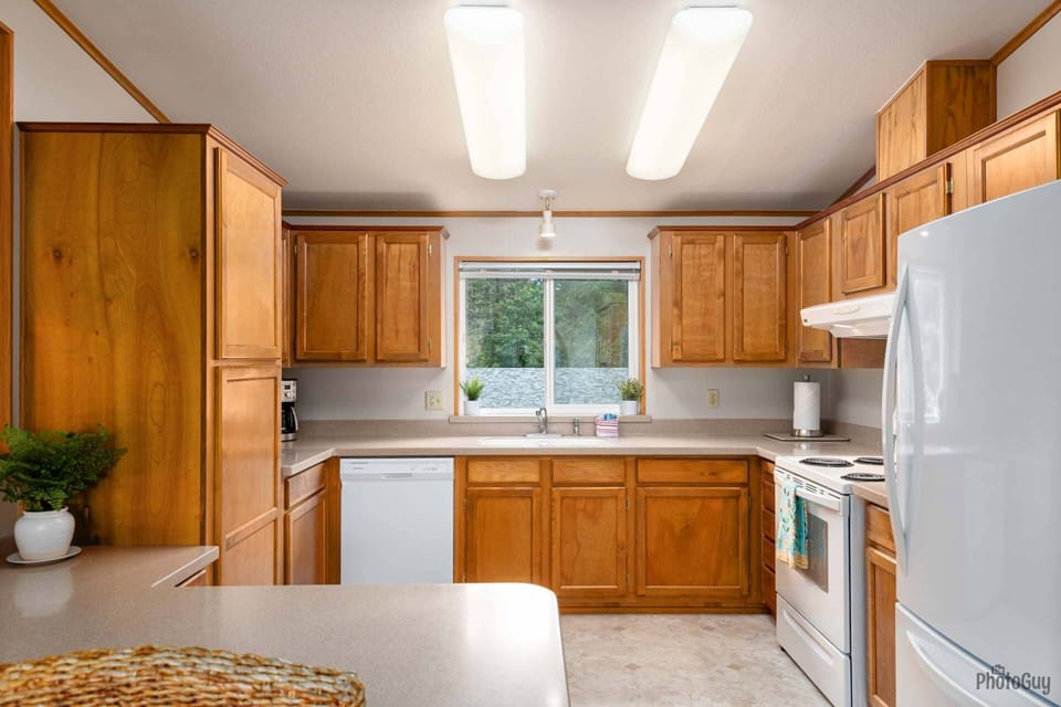 Full Kitchen View, Including Fridge and Stove