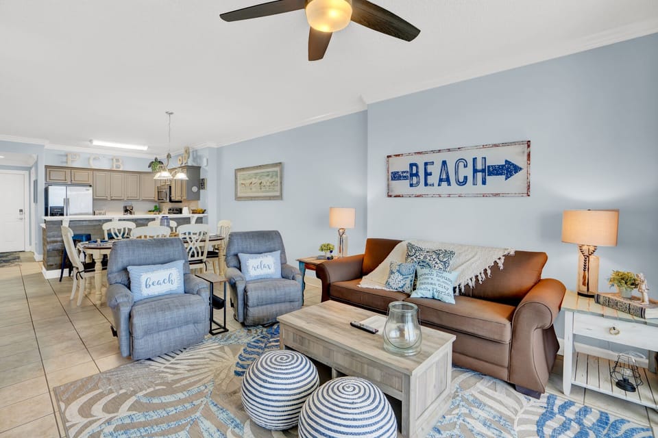 Sink into coastal comfort in your beach-themed living room, where soft blues and nautical touches create the perfect seaside retreat.
