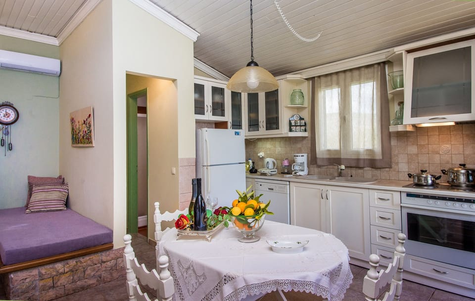 The dinning table and the kitchen.