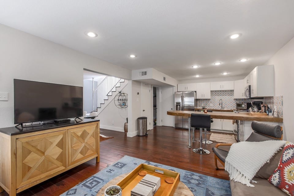 The living room is right next to the kitchen, giving you the perfect spot to relax or cook up a meal.