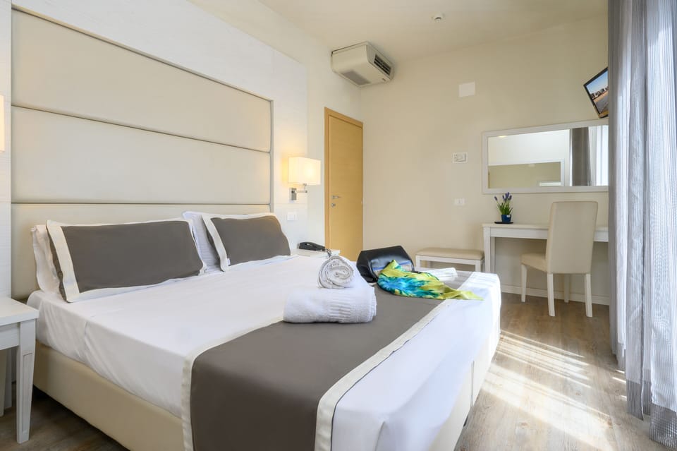 Family Quadruple Room, 2 Bedrooms | In-room safe, desk, free WiFi, bed sheets