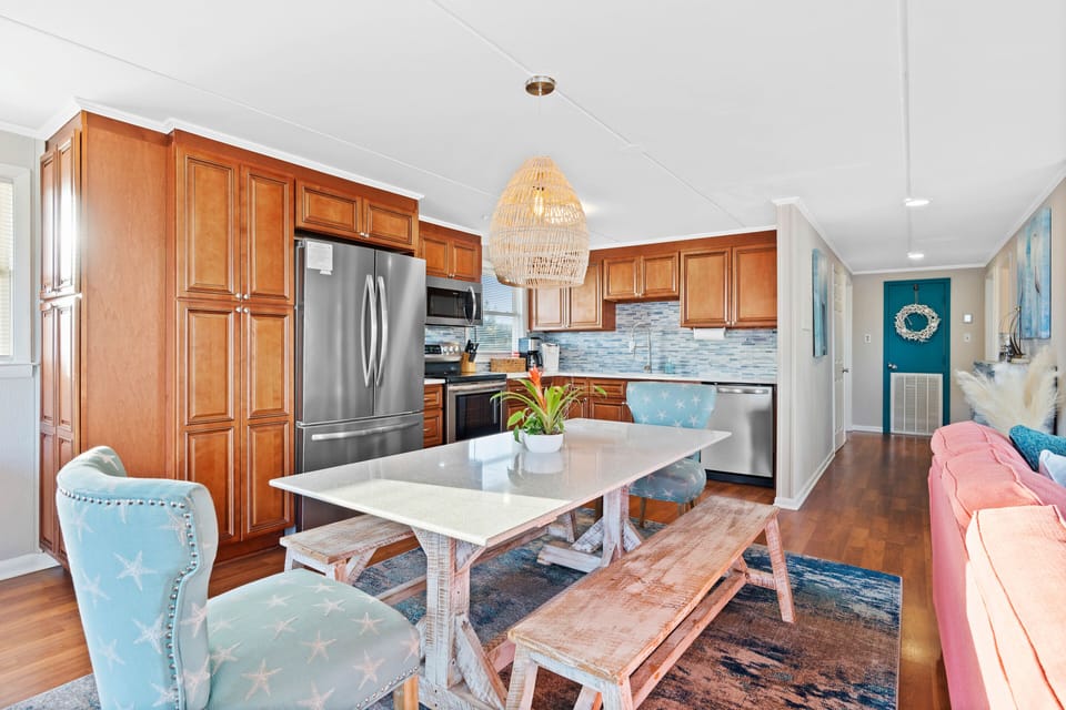 Open concept living space/dining room designed to accommodate 10 people.