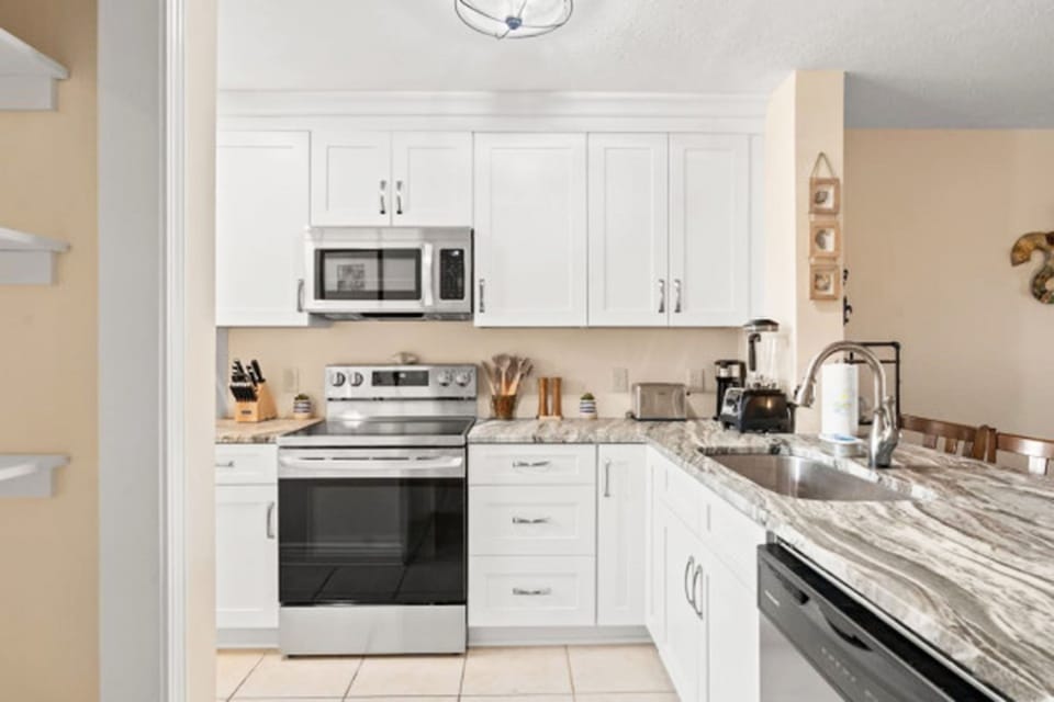 With its modern design and open sightlines, the kitchen feels like the heart of the home, perfect for gathering and entertaining.