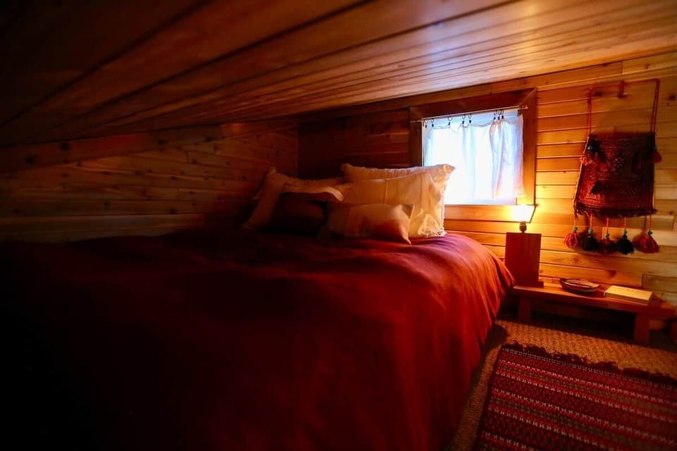 Cozy comfortable queen size bed in the sleeping loft. 