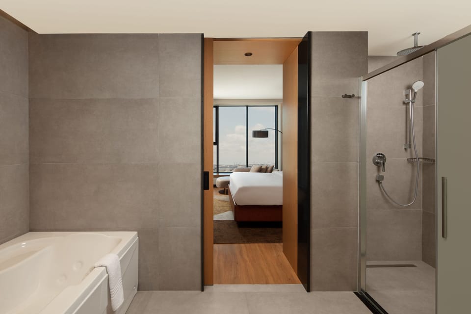 Shower, hair dryer, slippers, towels