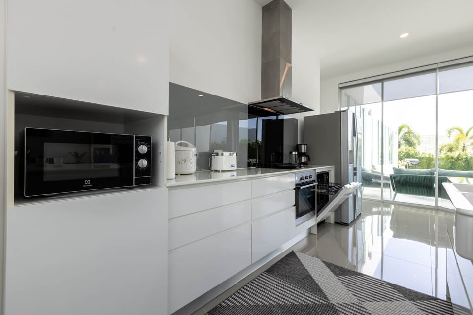 Family Villa | Private kitchen | Fridge, coffee/tea maker, electric kettle, highchair
