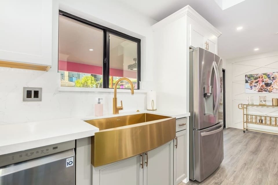 The large fridge/freezer has a water filter and ice maker, and is conveniently located near the bar cart!