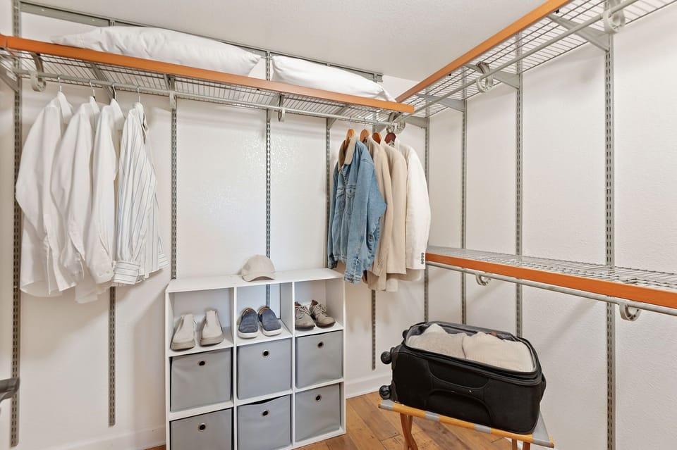 Walk-in closet in primary bedroom