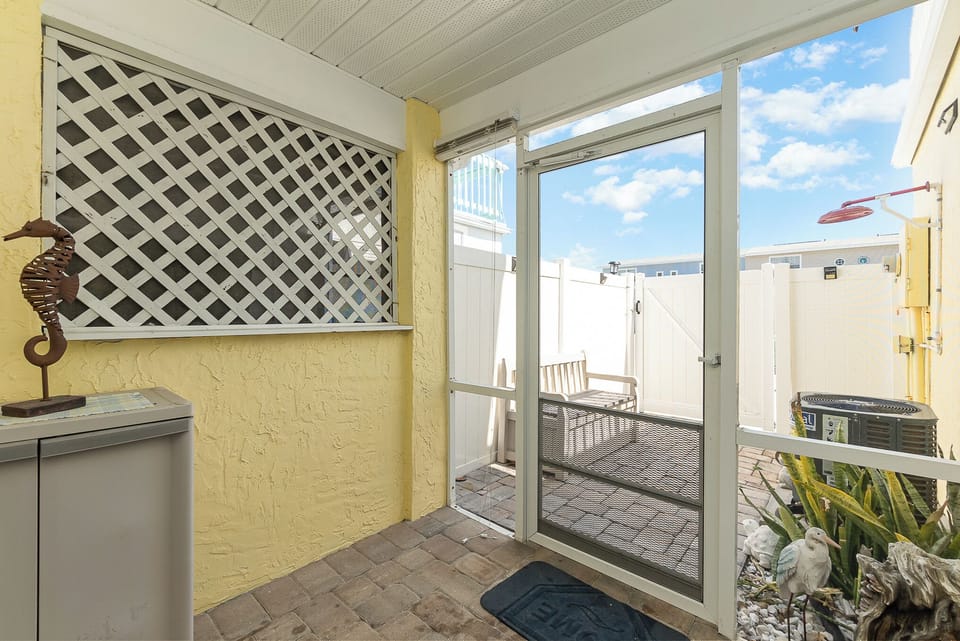 Private screened in porch as you enter!