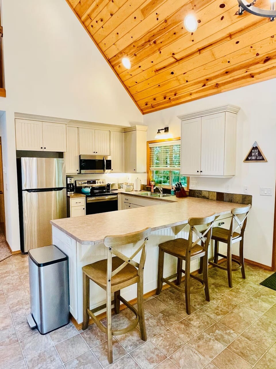 Kitchen with bar seating and plenty of room to prep food.  