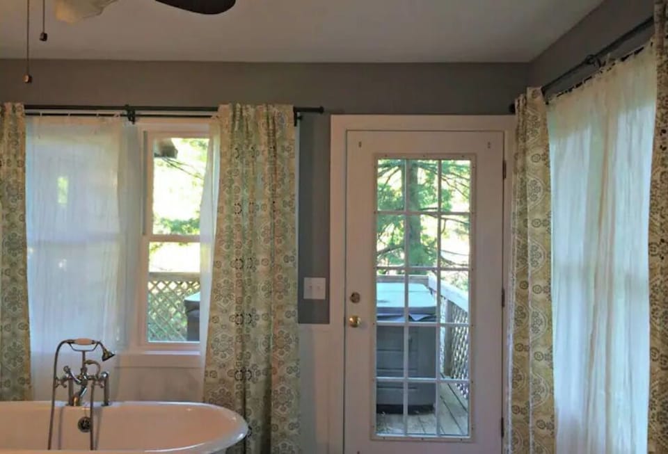 Door from master bath leads to deck and jacuzzi on the lake