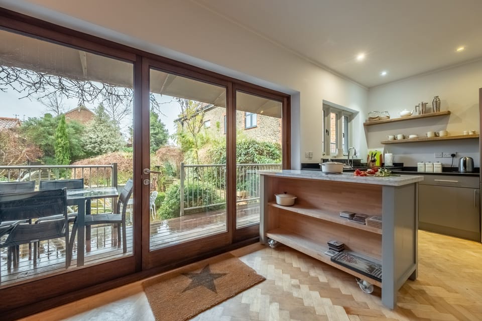 First floor: Kitchen leading to outdoor decking