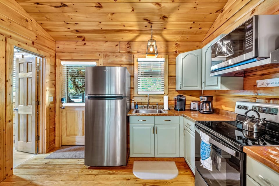 This kitchen has nearly everything you will need- except a dishwasher. Here we slow down and wash our dishes together by hand, or go out to eat!