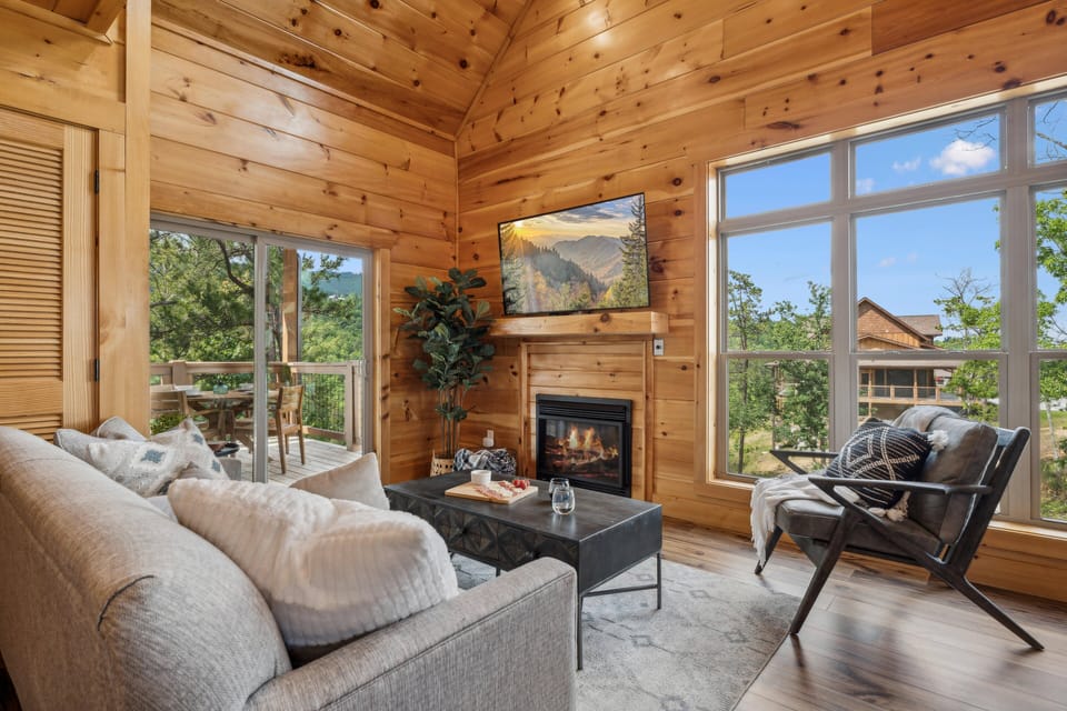 Relax by the fireplace after a day of exploring the top local attractions in Gatlinburg, Pigeon Forge, and Townsend | Elkridge Cabin by Great Smoky Mountains Cabin Rentals | Sevierville, TN