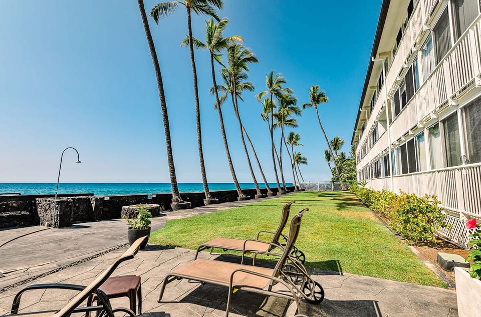 Private grass on ocean by pool