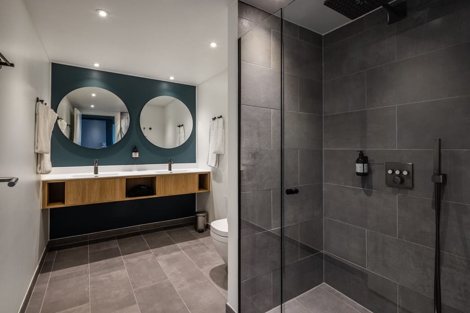 Junior Suite, Patio | Bathroom | Eco-friendly toiletries, hair dryer, towels