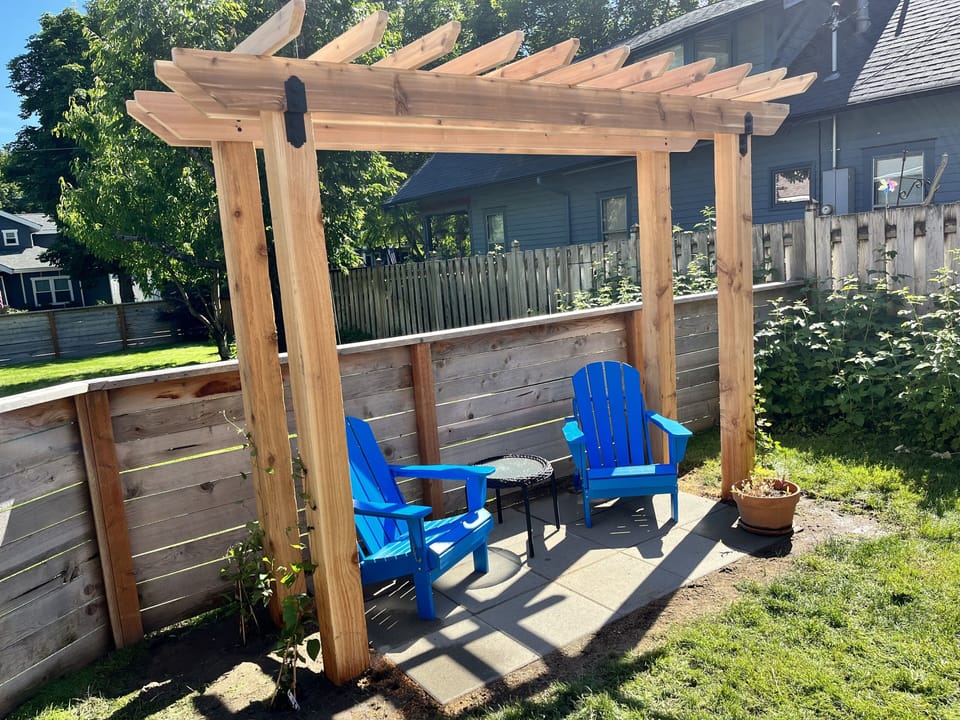 Unit has its own private fenced yard with nice sitting area 