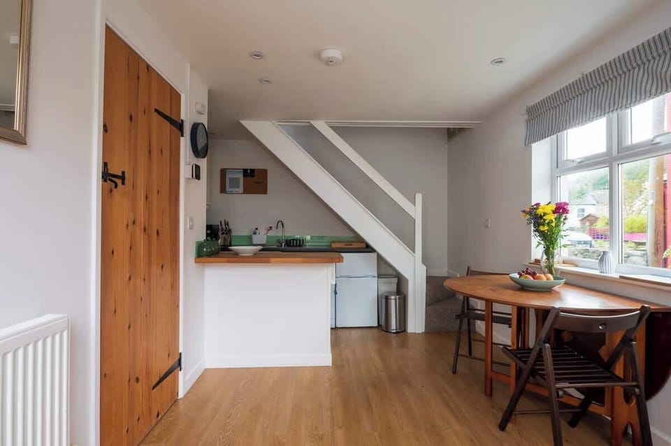 The open-plan kitchen and dining area leads to the lounge on the left, and the stairs to the master bedroom as the back. 

What our guests say: “A wonderful magical stay, which has everything you need to make a home from home” Michelle, Sept 21.