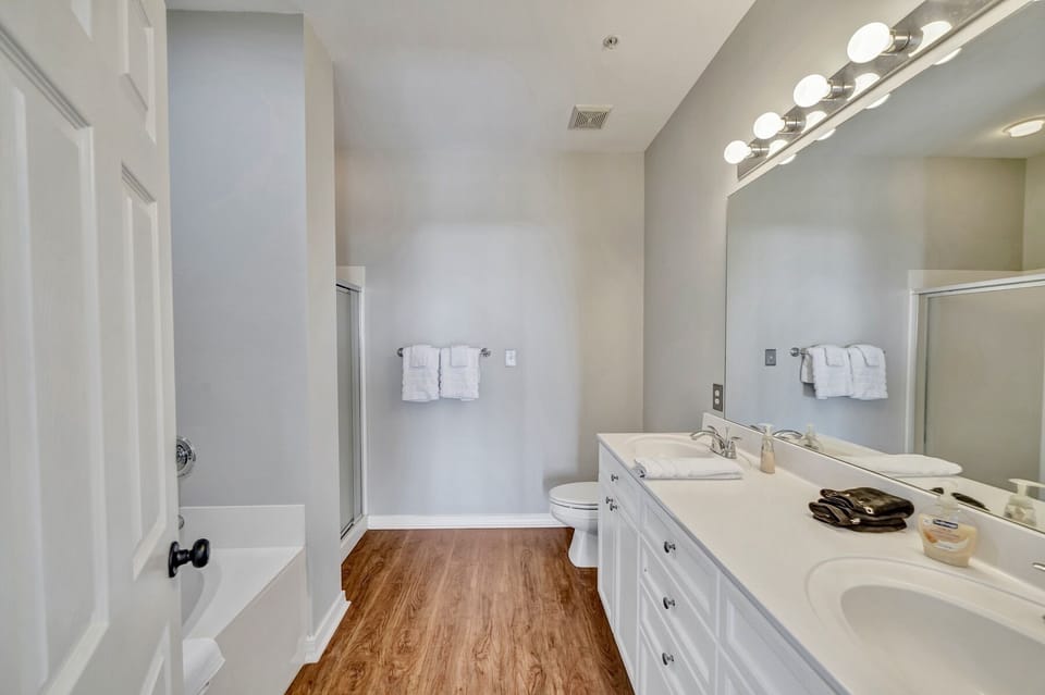 Full bath with separate soaking tub and shower