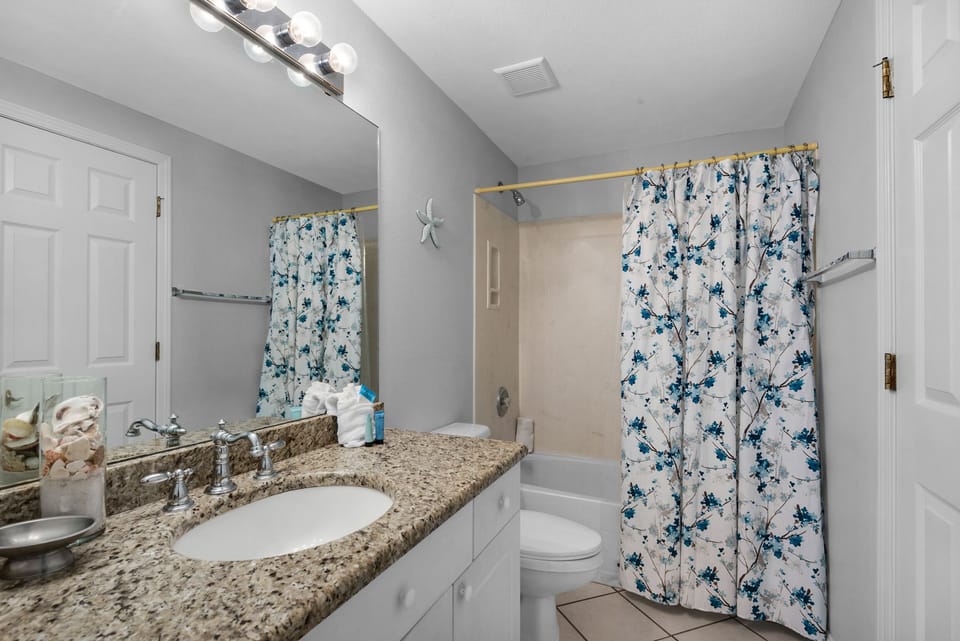 Full guest bath with shower-tub combo