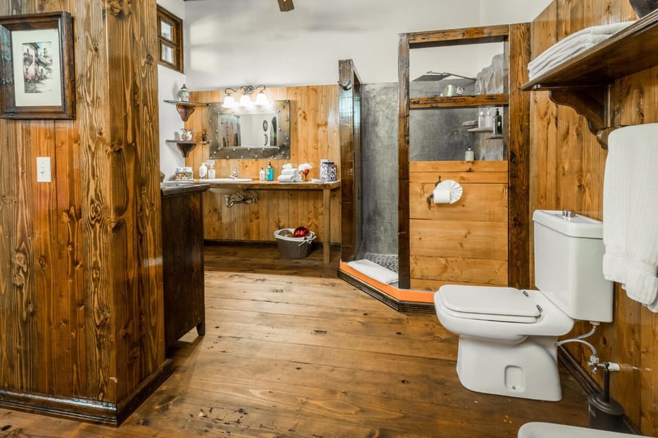 Bathroom with conditional air, amenities and beach towels.