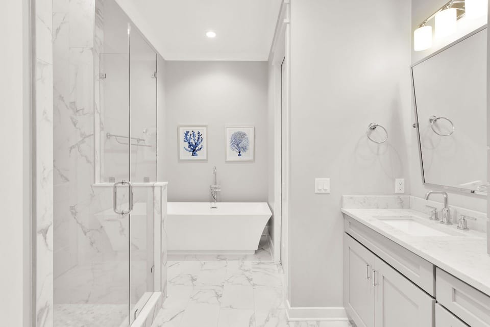 Bathroom 1 - ensuite bathroom to bedroom 1 . This bathroom has a tub and walk-in shower