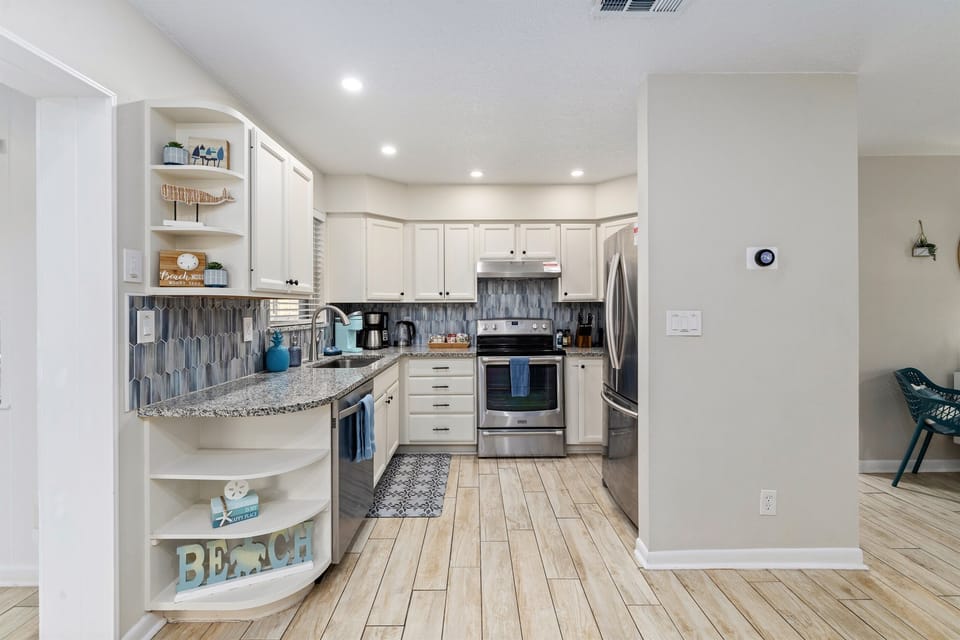 Fully stocked kitchen with modern appliances for efortless cooking