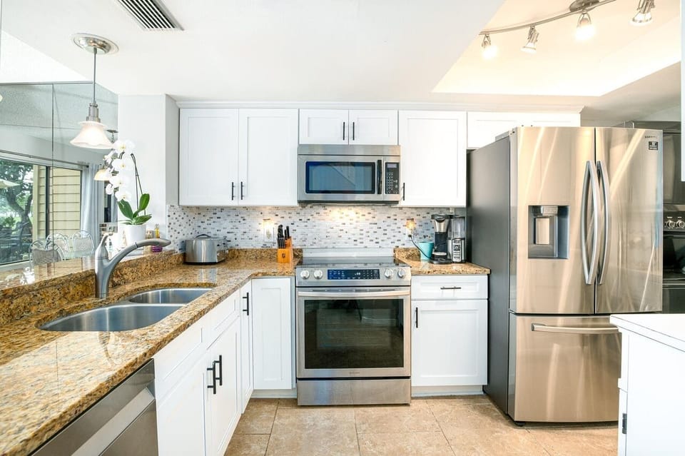 - Modern kitchen with stainless appliances ready for easy meals   - Spacious counters and bright lighting for cooking   - A clean organized space great for extended stays