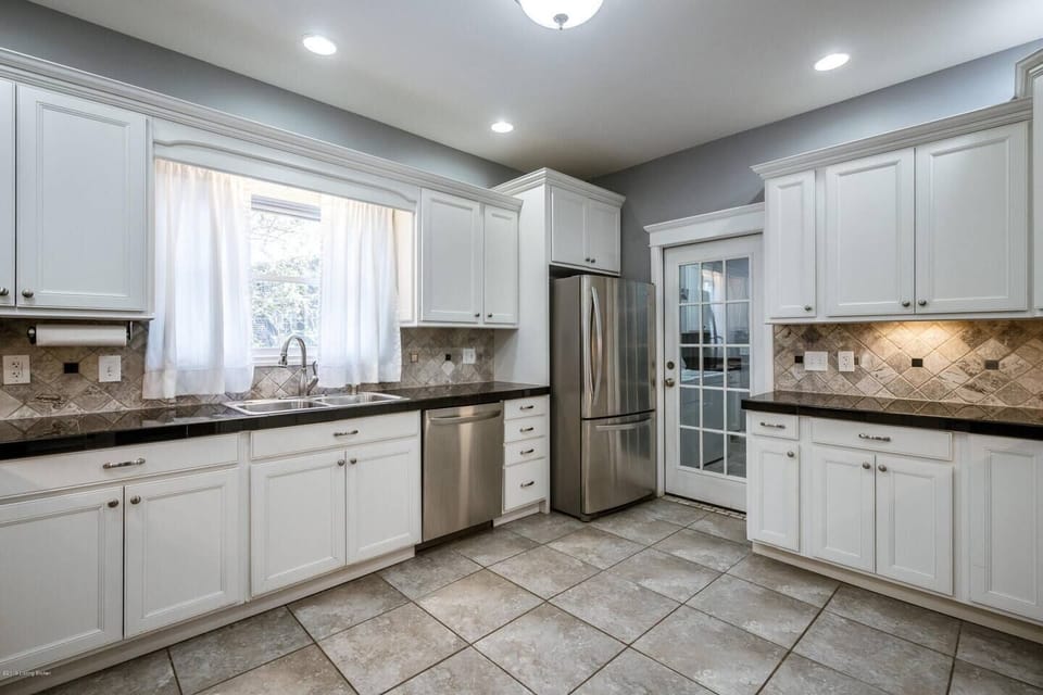Natural light fills the kitchen space which leads to the backyard.