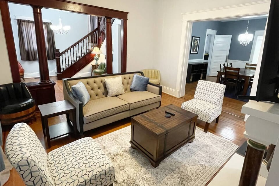 Formal living room open to dining area. Plenty of space to gather and watch the 75" 4KTV