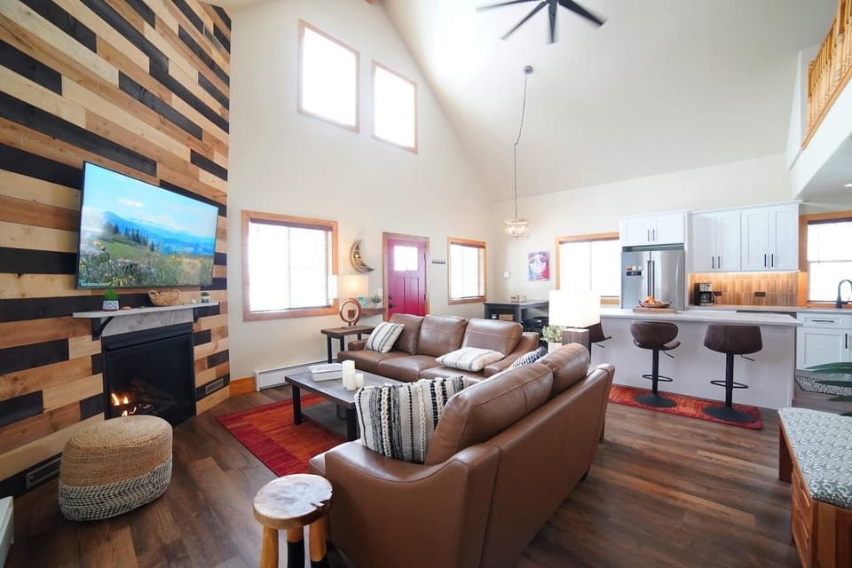 Whether you are relaxing in the living room, eating at the dining room table, or hanging in the kitchen, you are always a part of the fun in this home. 