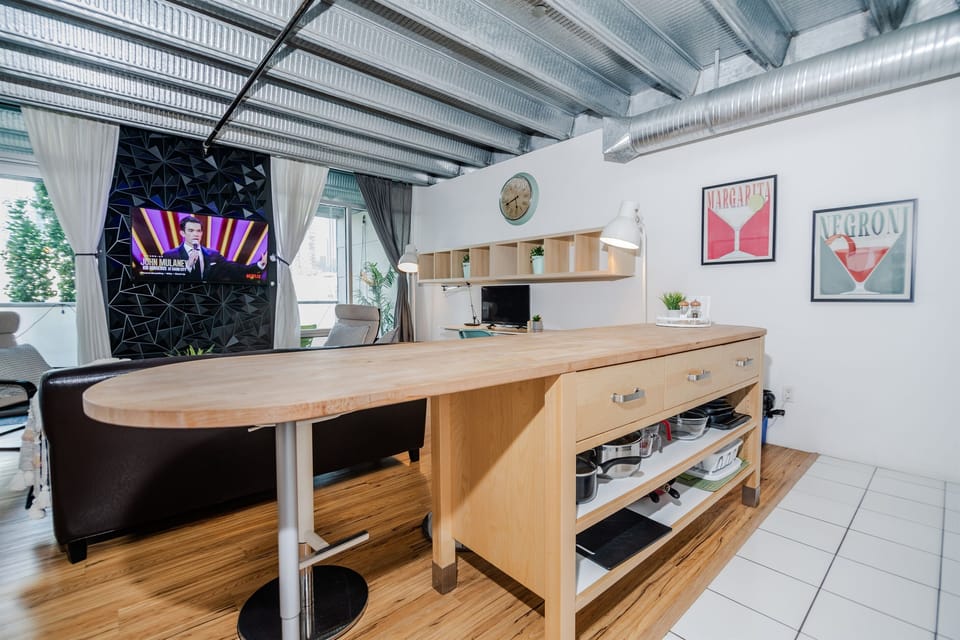 Dining Area: The kitchen island comfortably seats 3 guests.