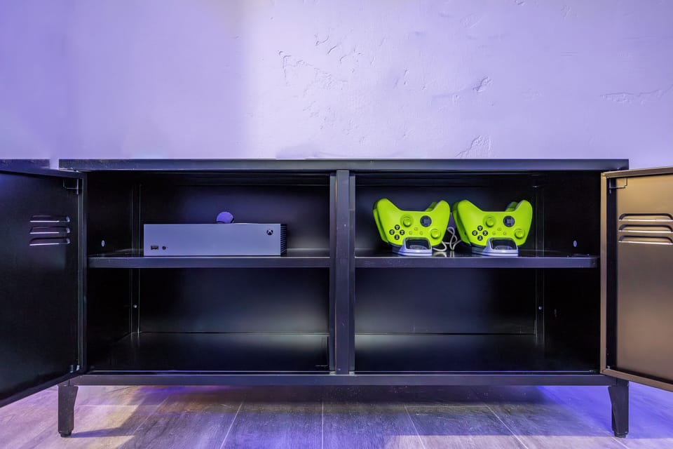 Xbox with 4 controllers provided. 