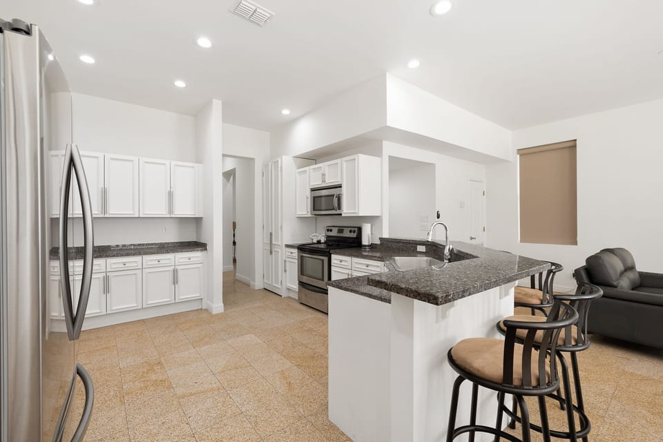 Fully equipped kitchen with granite counter tops and  stainless steel appliances