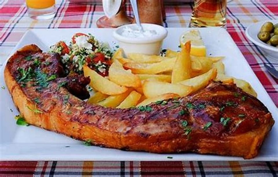 Our and Cyprus Locals Favourite, The  Giant Pork Chop. You wont be disappointed 