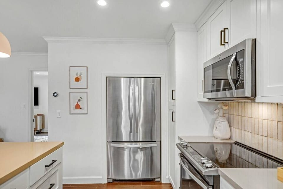 You`ll find high end stainless steel appliances in this large kitchen