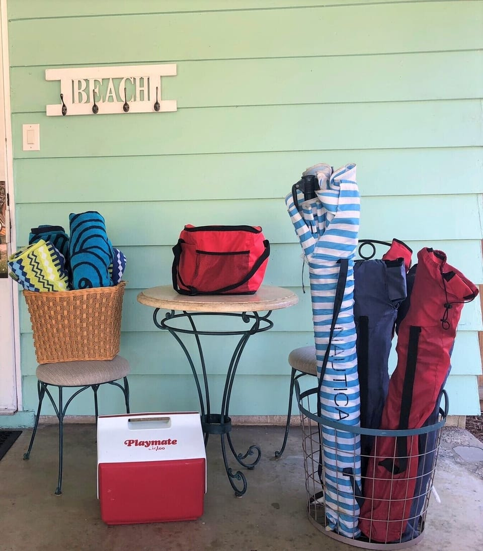 Beach towels, chairs, Umbrella, coolers. Toys/Boogies boards also available