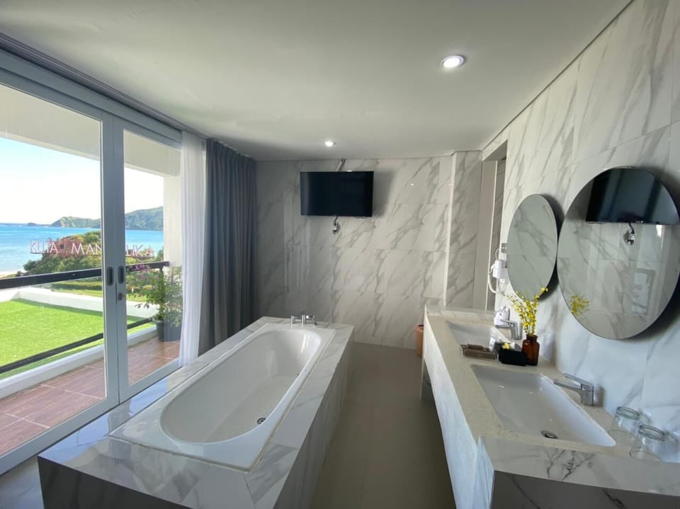 Separate tub and shower, hair dryer, slippers, towels