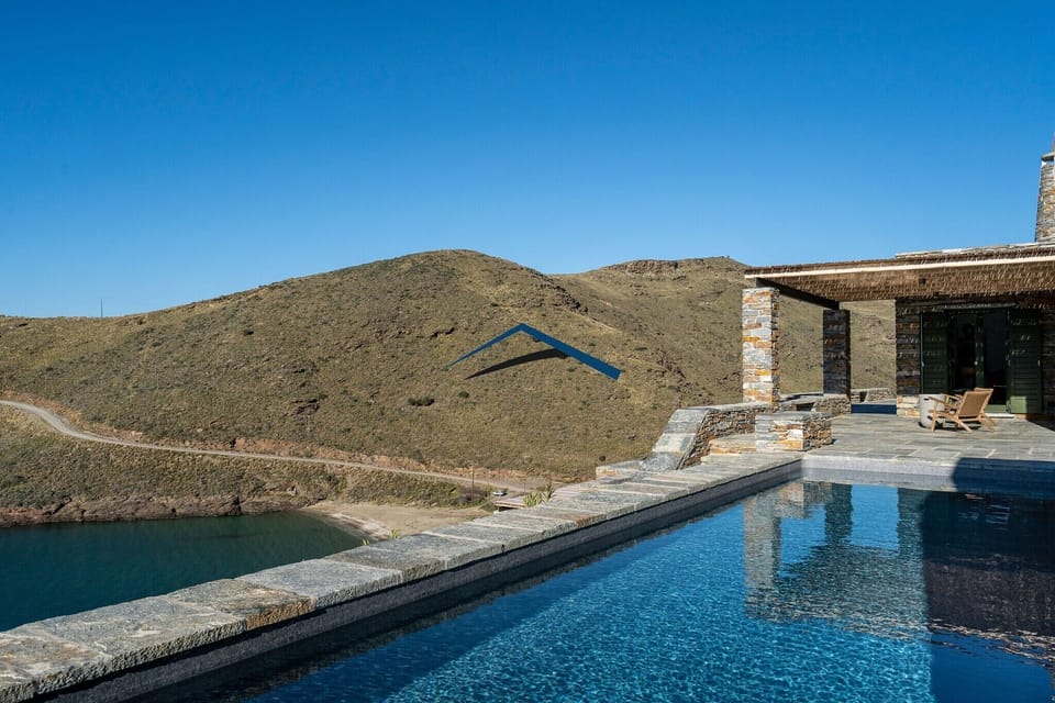 The villa and the sandy beach of Xyla below