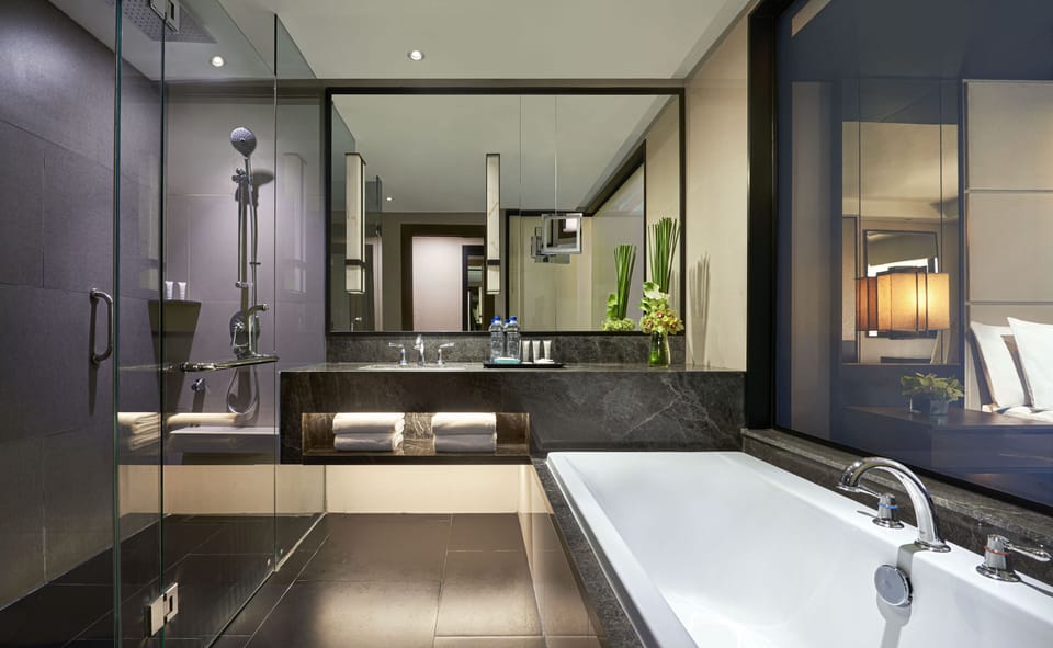 Combined shower/tub, hair dryer, slippers, towels