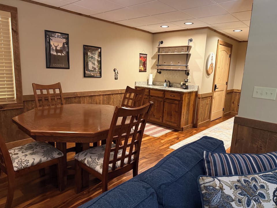 Lower level living area with game table and wet bar