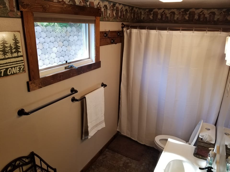 Bathroom with vanity and tub/shower.