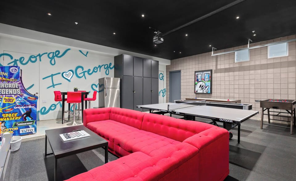 Entertainment suite at The George in Old Town Scottsdale. Featuring ping pong, arcade games, shuffleboard, and a modern lounge area, this luxury micro-hotel delivers a built-in social space ideal for group trips and high-end Scottsdale stays.