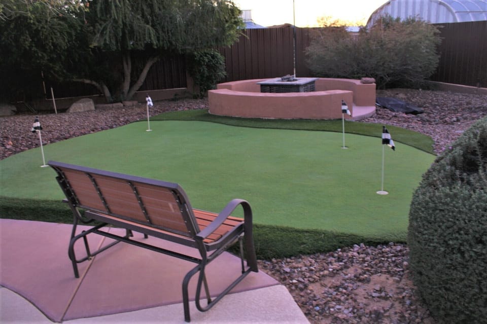 Beautiful putting green next to the massive fire pit. 